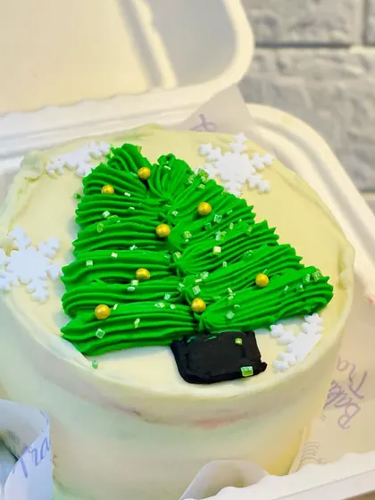 Another one of my Christmas bento cake designs. This one features a buttercream Christmas tree decorated with gold sprinkles, all on a delicious and moist eggless cake.