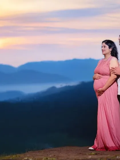 An epic maternity portrait of a couple overlooking a misty mountain range at sunrise. I can travel to scenic locations to create truly unforgettable and breathtaking images for you.