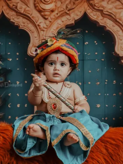 Our little Kanha stealing hearts, not butter. The rich, warm tones of this setup create a regal feel.