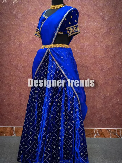 Another view of the royal blue velvet half saree, showing its rich texture and elegant drape.
