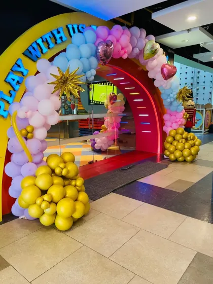 The grand entrance to a magical party. This balloon arch, with its rainbow of pastel colors and star accents, creates a spectacular welcome for the birthday child and their guests.