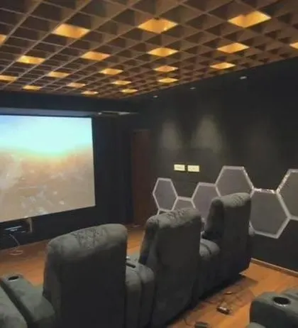 This is a complete, dedicated home theater I built for a client. It features a full-size projector screen, comfortable recliners, and professionally installed acoustic panels on the walls and ceiling to ensure the sound is just as impressive as the picture.