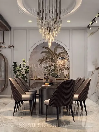 A complete view of the Janakpuri dining and kitchen area, featuring a beautiful archway with a mural and an open-plan layout that is ideal for modern family living.