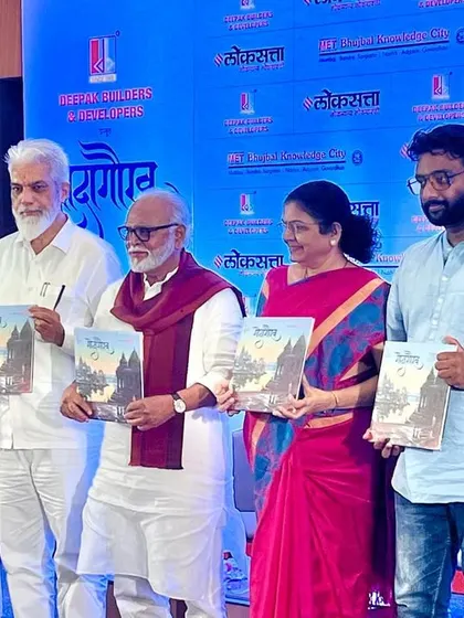 A photo from the launch event of the "Godagaurav" coffee table book, where my paintings were featured on the cover. Here, dignitaries are holding the book.