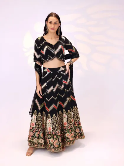Another angle of the black georgette lehenga, showing how the sheer dupatta can be styled for a light, airy feel.