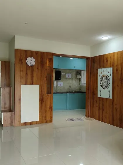 Another view of the wooden partition and entryway, showcasing the clean lines and polished finish of the completed work.