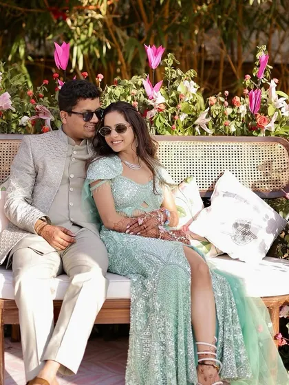A happy couple enjoying their vibrant pink Mehendi in Jaipur. The decor is designed to create beautiful moments and perfect photo opportunities.