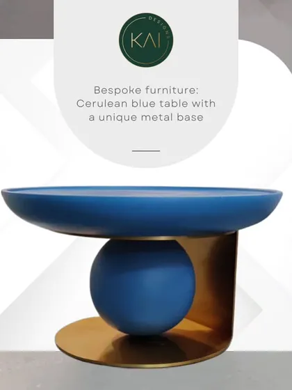A unique sculptural side table in a vibrant cerulean blue, set on a distinctive brass metal base. This piece is functional art, designed to add a pop of color and modern flair to any interior.