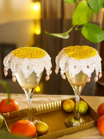 My beaded glass covers, adding a touch of elegance to a simple drink.