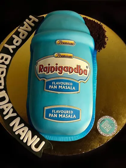 A fun and quirky cake designed to look exactly like a tin of Rajnigandha pan masala. It’s a perfect example of a personalized, realistic cake that brings a smile to everyone's face.