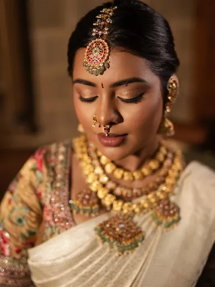 A close-up of the eye makeup, showing the soft, shimmery tones and perfectly groomed brows.