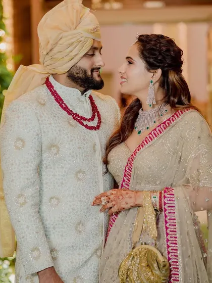 A lovely couple portrait of the bride's sister and her husband. She is glowing with happiness.