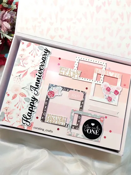 The cover of the 25th anniversary scrapbook, featuring layered frames and the words "Picture Perfect."
