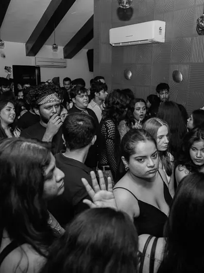 A black and white shot of the packed house in Pune. The love is real.