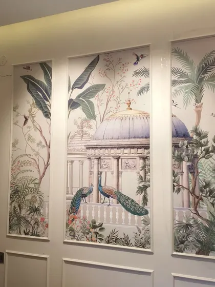A stunning, large-scale mural depicting a classical garden scene with peacocks and lush foliage. Installed as a triptych, it serves as a sophisticated and artistic centerpiece for the room.