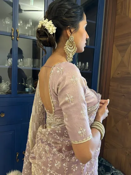 This classic gajra bun is the epitome of traditional elegance. The fresh flowers woven into the hair create a timeless and fragrant accessory for any Indian wedding or ceremony.
