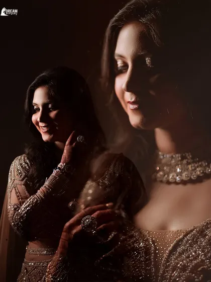 A soft, double-exposure style portrait of bride Ekta, creating a dreamy and romantic feel for her Sagan day look.
