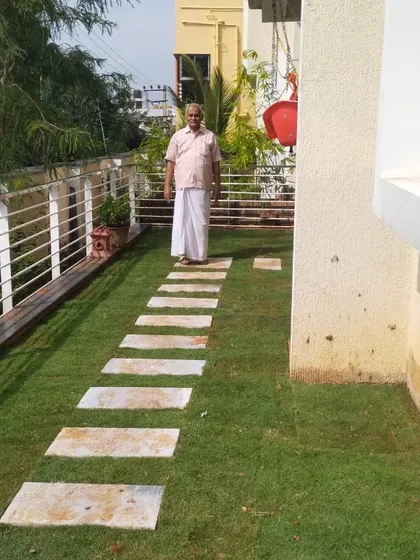 A client enjoying their newly installed terrace lawn with a stone pathway. My goal is to create functional and beautiful spaces that my clients can enjoy from day one.