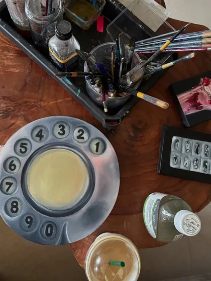 A collection of my smaller paintings, including a vintage rotary phone and a slice of cake. These pieces are often experiments in style and subject matter.