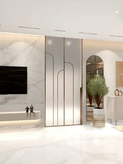 This family lounge combines a feature wall of book-matched marble with decorative mirrored panels to create a sense of glamour and space. The floating media console and minimalist decor keep the look clean and contemporary.