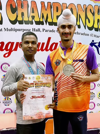 Another shot with my coach and my medals from the Senior National 2024. His pride in my performance is evident.