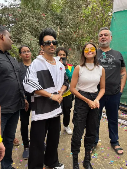 A candid interaction between the artists at the Holi event.
