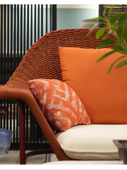 A close-up shot from my collaboration with Cairo Indoor Outdoor. The vibrant orange cushion and textured wicker of this chair are perfect for adding a pop of color and natural texture to a space.