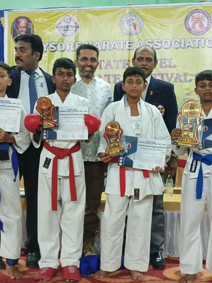 My students with their certificates and trophies at the Mysore Dasara Karate Championship 2024, a prestigious state-level event.
