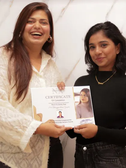 A happy moment with one of my graduates. Her laughter and confidence are the best rewards for a mentor.