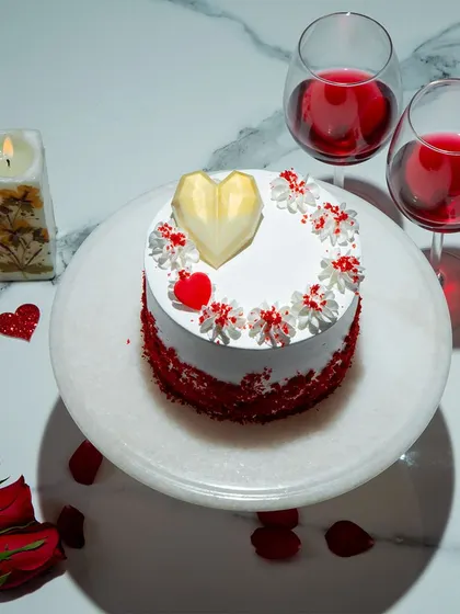 We celebrate love with our heart-shaped red velvet cake. The rich, crimson layers and classic cream cheese frosting are a timeless combination, making this a perfect and romantic choice for an anniversary or Valentine's Day.