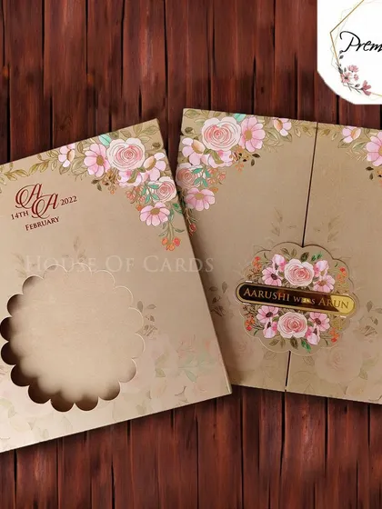 A beautiful floral gate-fold invitation with a die-cut window, revealing a personalized nameplate inside.
