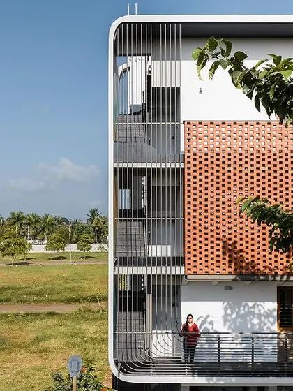 A view of the 'House Belaku' facade, showing how it provides privacy for the balconies while still allowing views out.
