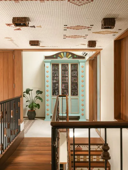 A straight-on view of the bar cabinet, highlighting its symmetrical design and the intricate details of the stained glass and woodwork.