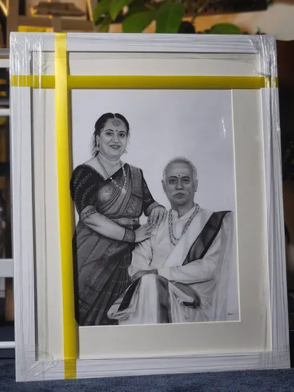 The finished portrait, framed in white and ready for delivery.