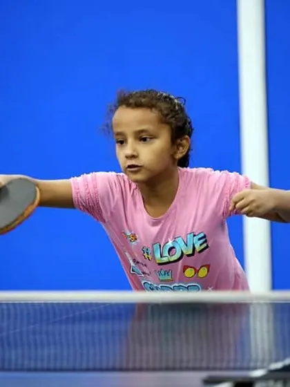 This young player is focused on her backhand return. We start with the basics of grip and posture to ensure every student develops a strong technical foundation for their game.