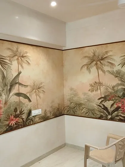 A vintage-style tropical mural installed in the corner of a dining area. The warm tones and classic illustrations give the space a timeless and elegant feel.