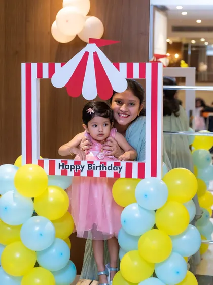 A fun moment captured using a photo booth frame at a child's birthday party. We are always ready to photograph the playful and interactive parts of your event.