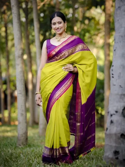 Every saree tells a story. This pure Mysore crepe in a lime green and purple combination is a timeless classic, perfect for any occasion.