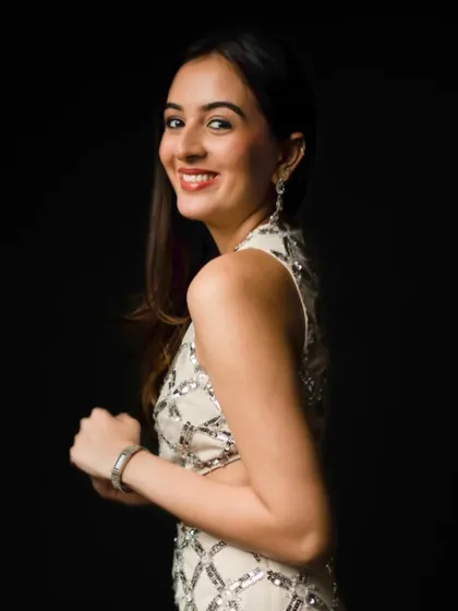 Effortlessly chic with a hint of sparkle. This look for actress Gayatri Jayaram is perfect for a red carpet or a glamorous event.