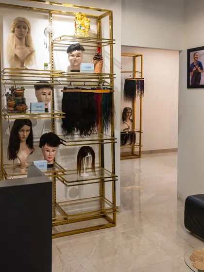 Another view of our studio, showing the reception area and product displays. We believe in transparency and want you to feel confident in the quality of our work from the moment you walk in.