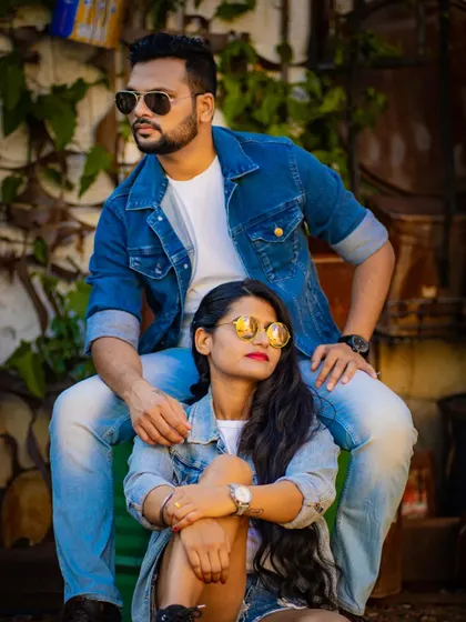 A fashionable pre-wedding portrait with the couple in coordinated denim outfits, exuding confidence and style.