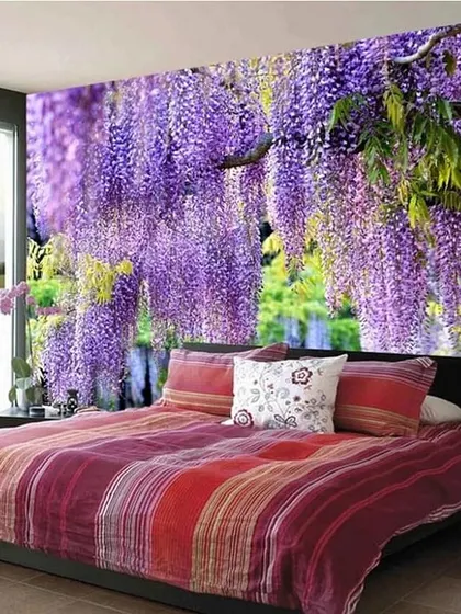 A romantic bedroom concept featuring a wall covered in a purple wisteria mural. This design can make a bedroom feel like a magical, floral hideaway.