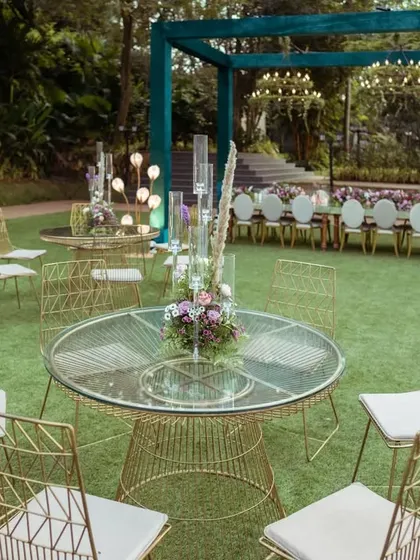 The layout was designed to feel open and spacious. We used a mix of round and long tables with elegant gold chairs to create different zones for guests to mingle.