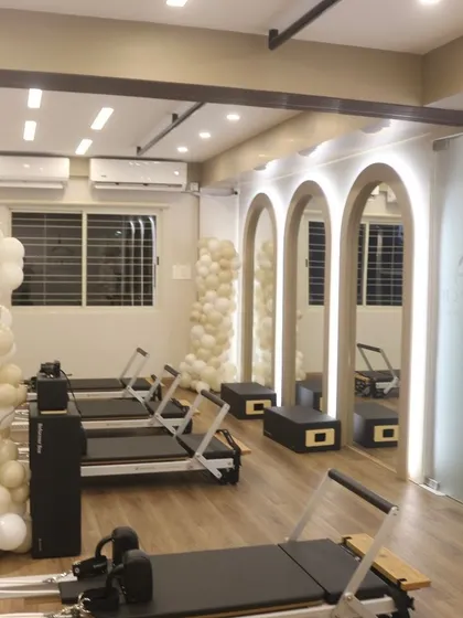 Another view of the studio at night, with the arched mirrors and clean lines creating a calm and focused atmosphere.