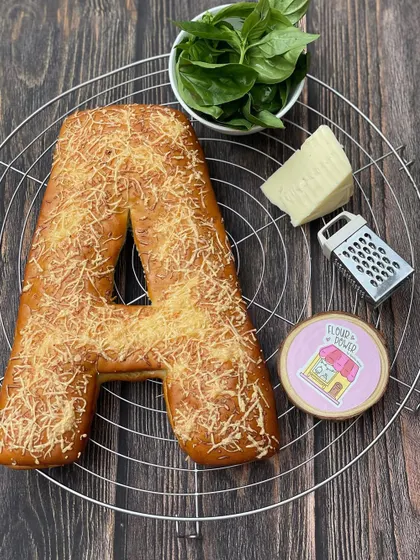 A savoury version of my initial pull-apart bread, this 'A' is made with my pesto cheese recipe and topped with grated parmesan.