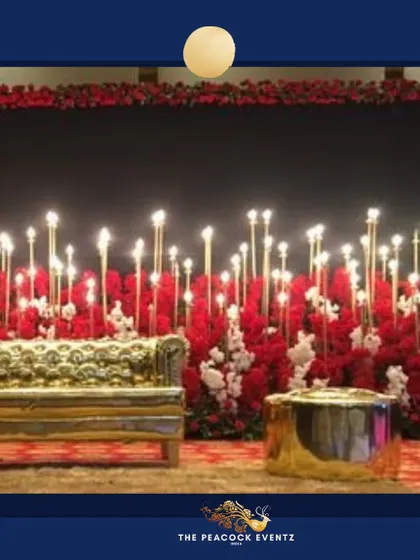 For a glamorous Sangeet or cocktail night, I designed this stunning stage combining a rich red floral base with dozens of glowing candles. The custom gold couch adds a touch of royalty, creating a perfect photo-ready backdrop for an evening of celebration.