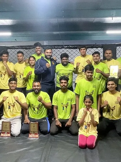 The entire team celebrating after our in-house kickboxing championship. These events are a great way to build experience and strengthen our community.