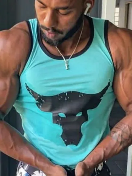 A front-facing shot of my client during his muscle-gaining phase. The arm and shoulder size is noticeably improved.