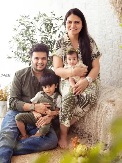 Now a beautiful family of four. It's wonderful to capture the growing family and the sweet interaction between the two siblings.