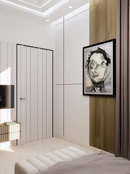 A guest bedroom design for a project in Greater Noida. The room features a minimalist aesthetic with clean lines, a neutral color palette, and a bold piece of art to add character.